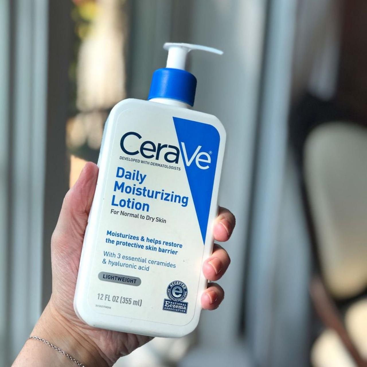 Woman applying Cerave daily face lotion for glowing skin